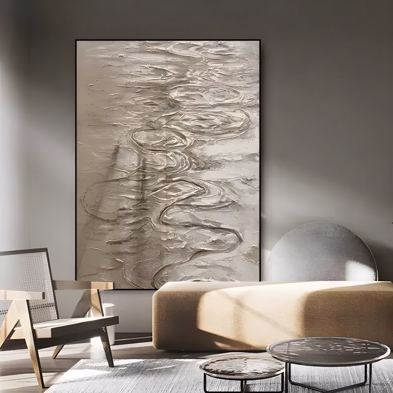 a large vertical relief painting of swirling ripple lines worked into thick beige plaster, loops and curls gathered down the center of the frame and fading to a plain gray-taupe field at the edges, in troweled texture