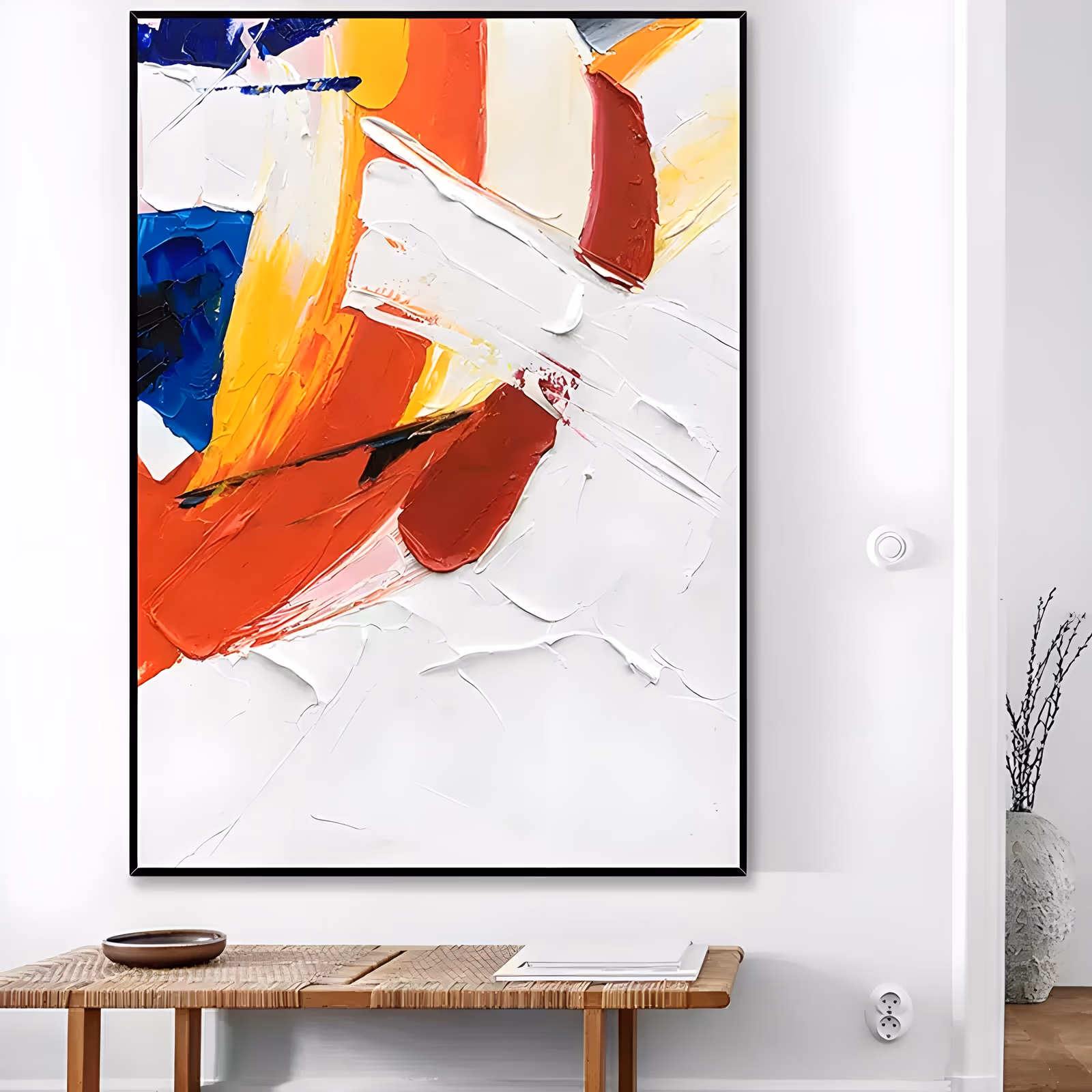 a large vertical abstract painting of broad red, orange, yellow and cobalt blue knife strokes crowded into the upper left, with the rest of the canvas left as bare white impasto ridges