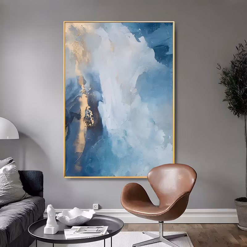 a large vertical abstract oil painting of soft blue and white cloud forms rolling up the canvas, with a broad band of gold leaf down the left edge, and thick white knife highlights on top