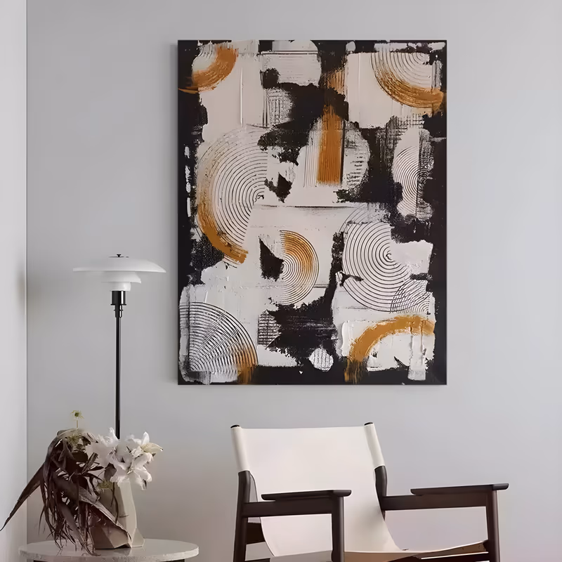 a large vertical abstract wall art panel of combed concentric circle ridges in white, black and burnt ochre, arranged in loose overlapping rows on a black ground, in raised sculpted plaster relief