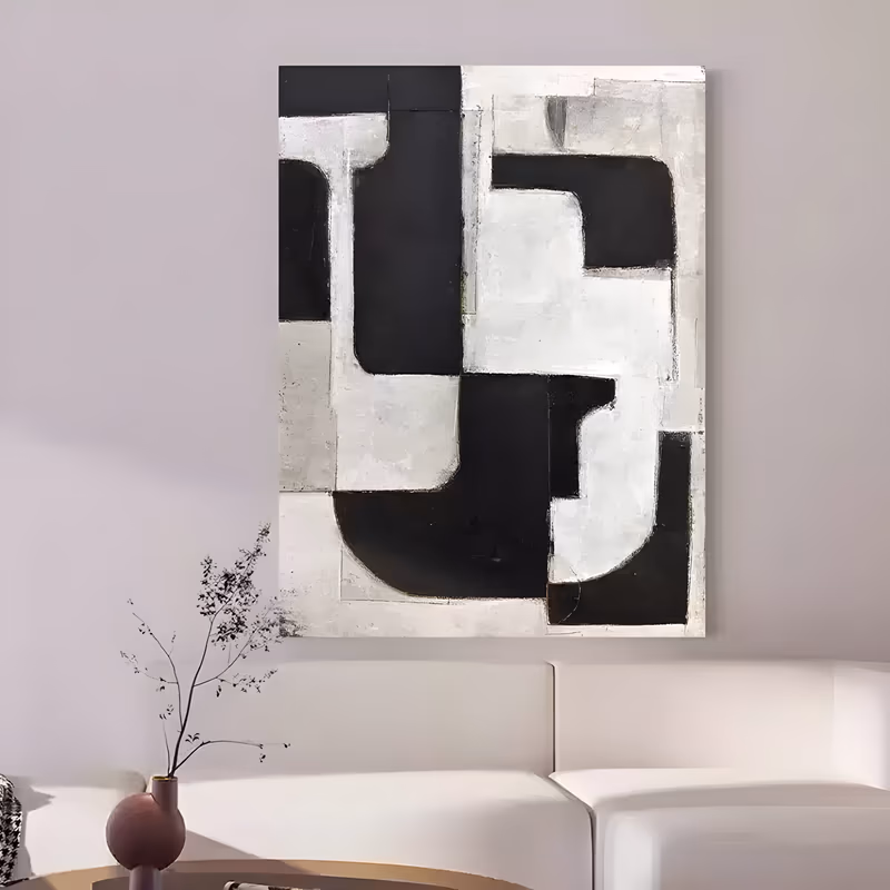 a large vertical abstract painting of interlocking black and chalky white block shapes with rounded corners, locking together like puzzle pieces over the canvas, in dry matte paint with scraped edges