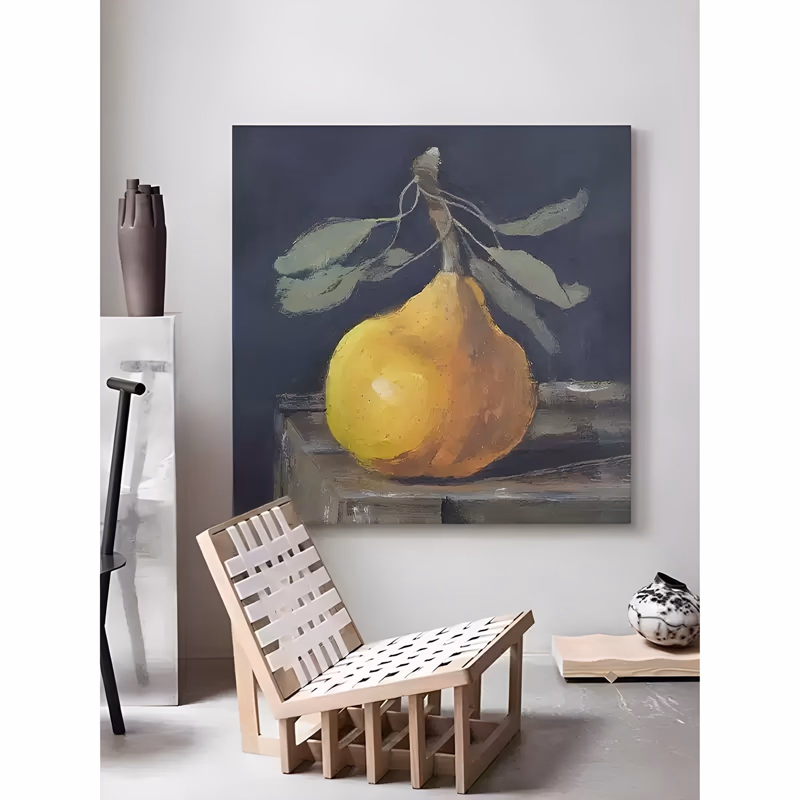 a large square realist painting of a single yellow and amber pear with sage-green leaves on its stalk, resting on a gray stone ledge against a deep navy ground, in soft blended oil