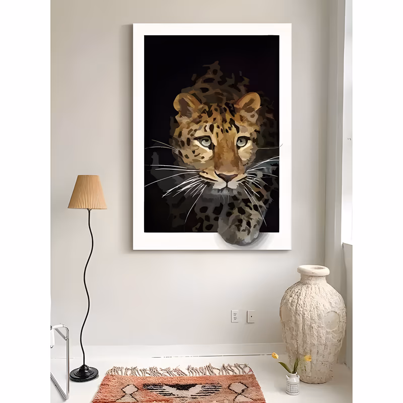 a large vertical animal painting of a leopard's head and one front paw emerging from a solid black background, its tan and gold coat marked with dark rosettes and long white whiskers, in flat matte acrylic