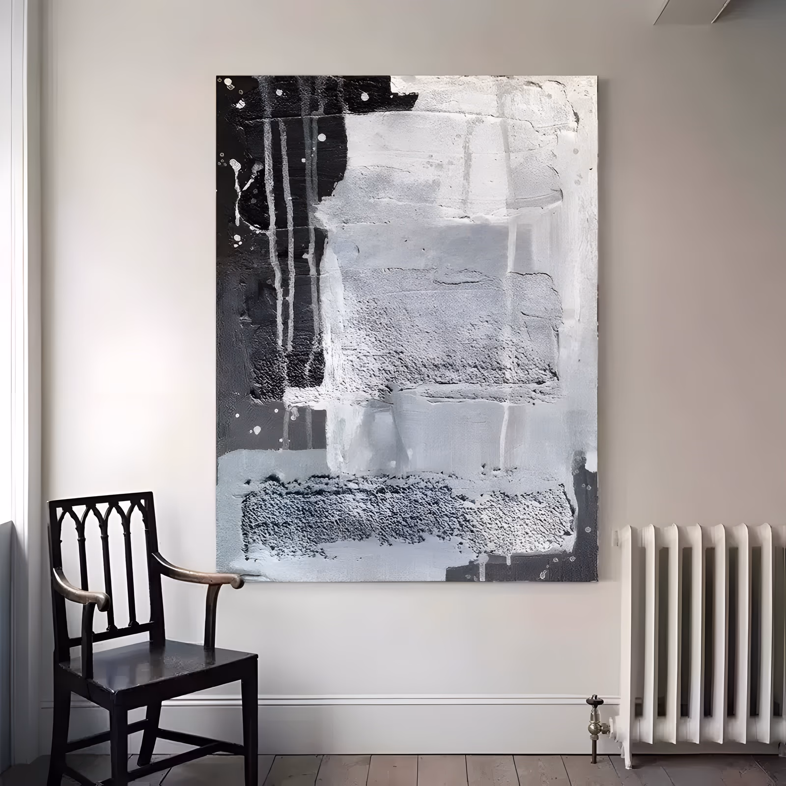 a tall vertical abstract painting of stacked gray and white textured slabs with a solid black block at the upper left, coarse granular bands below and thin white drips and splatters, in heavy impasto