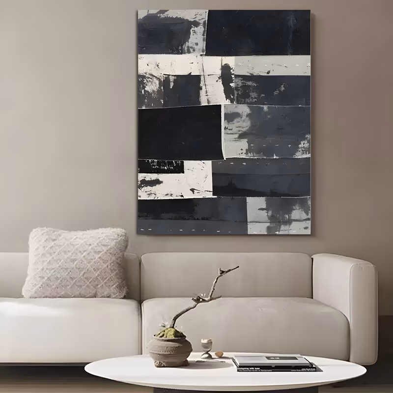 a large vertical abstract painting of a patchwork grid of rectangular blocks in black, charcoal, gray and chalky white, their edges torn and scuffed like pasted paper, in scraped layers of matte acrylic