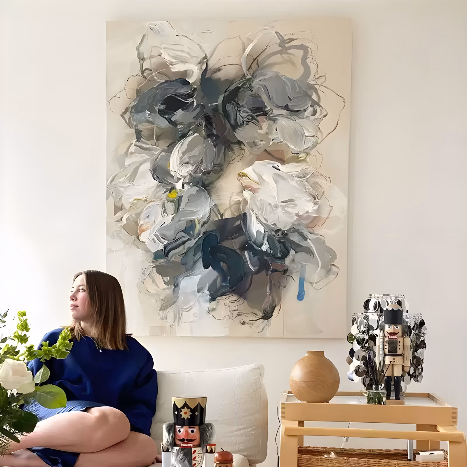 a large vertical abstract floral painting of oversized white and gray petals opening at the center of a cream ground, with slate blue and teal shadows and fine drawn lines, in heavy sculpted paint