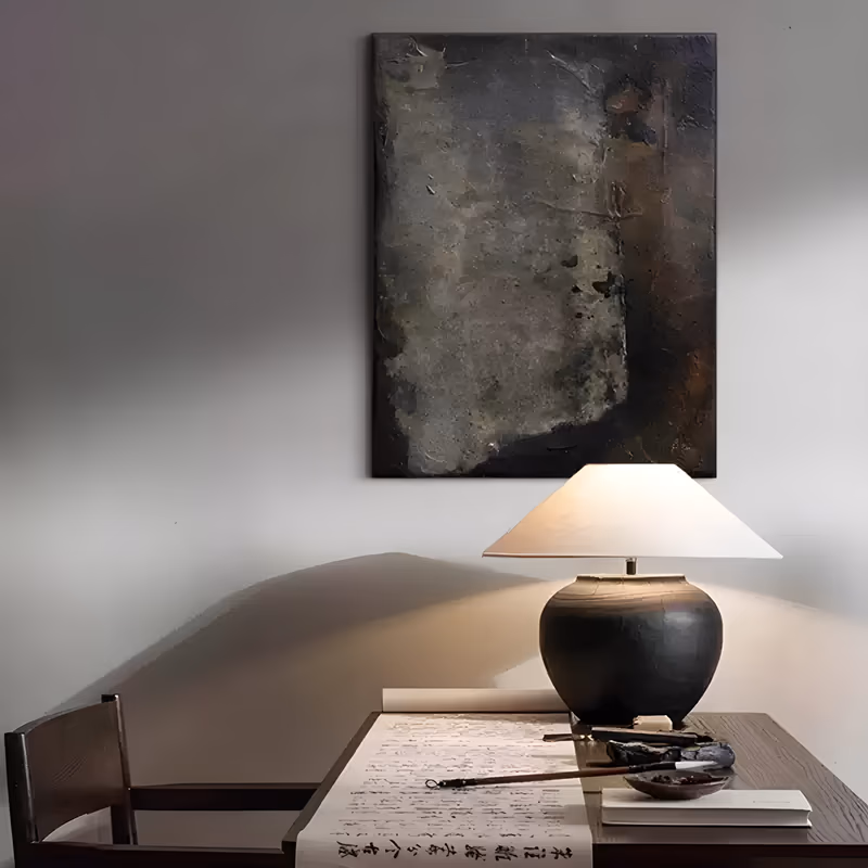 a large vertical wabi-sabi painting of a heavily textured charcoal and black field, scraped and pitted like an old wall, with a rust brown weathered band down the right side, in heavy impasto