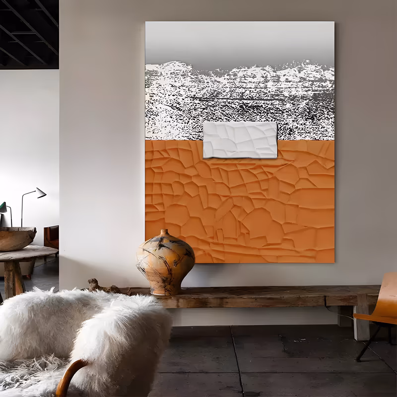 a large vertical textured abstract painting of a cracked terracotta-orange plaster field below a black and white speckled band, with a small white relief block set near the center, in sculpted relief