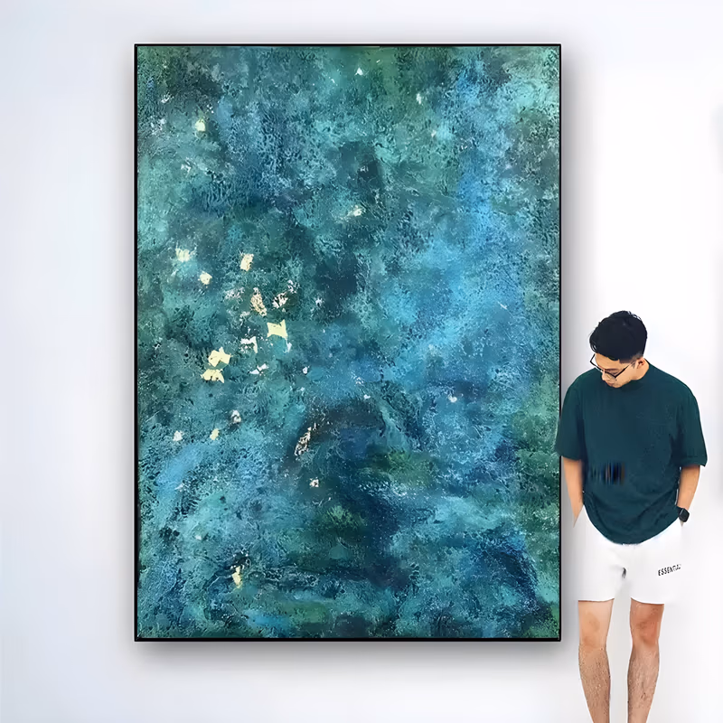 a large vertical abstract painting of a mottled teal and emerald field with cloudy darker pools, flecked with small squares of gold leaf near the left side, in thin textured layers of oil