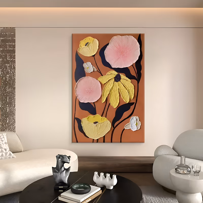 a large vertical relief painting of pink and yellow sculpted plaster poppies with dark purple centers, joined by small white blooms and navy stems and leaves, on a warm terracotta ground, in raised plaster