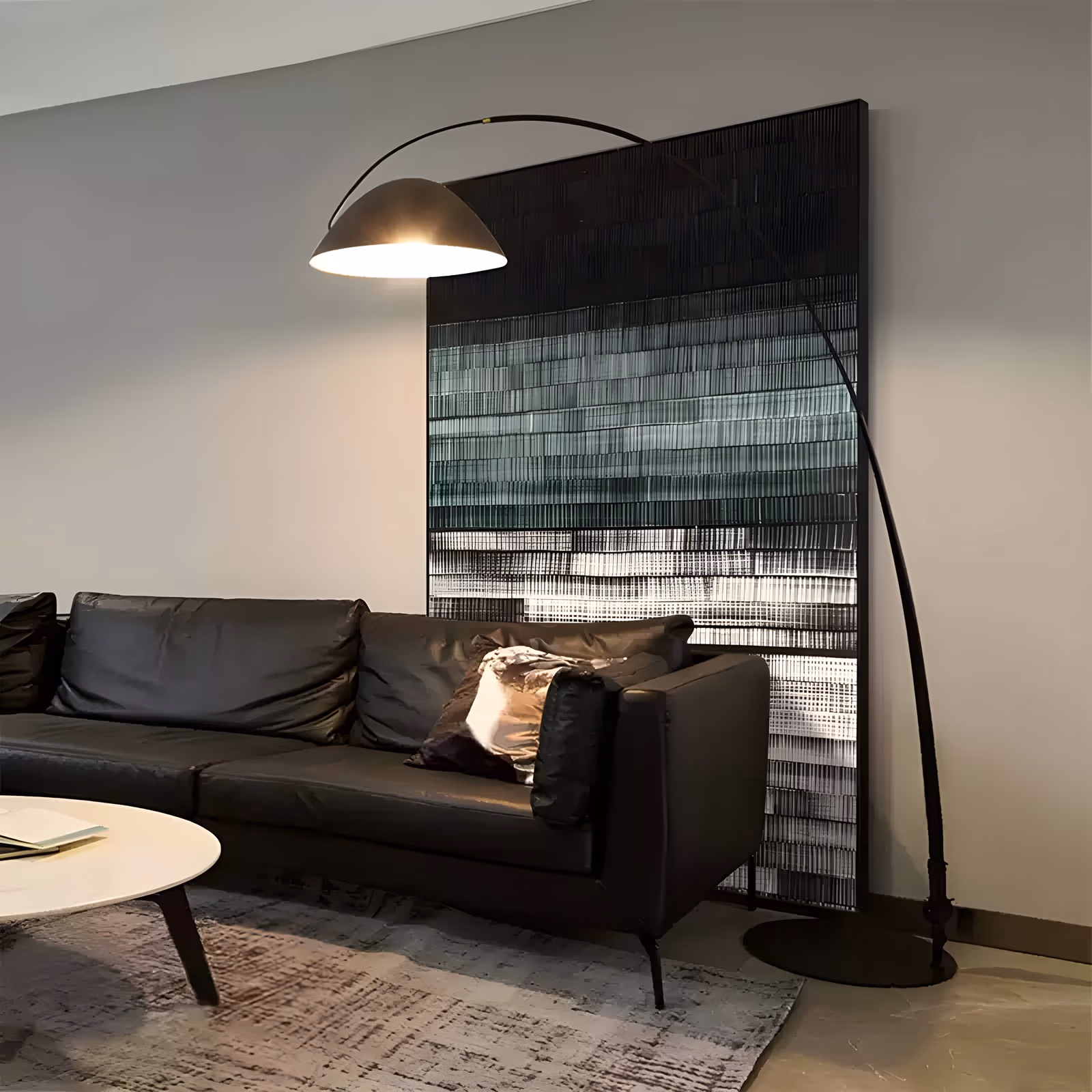 a large vertical abstract wall panel of dense horizontal bands built from fine raised lines, shifting from solid black at the top through teal gray to bright white at the base, in three-dimensional relief