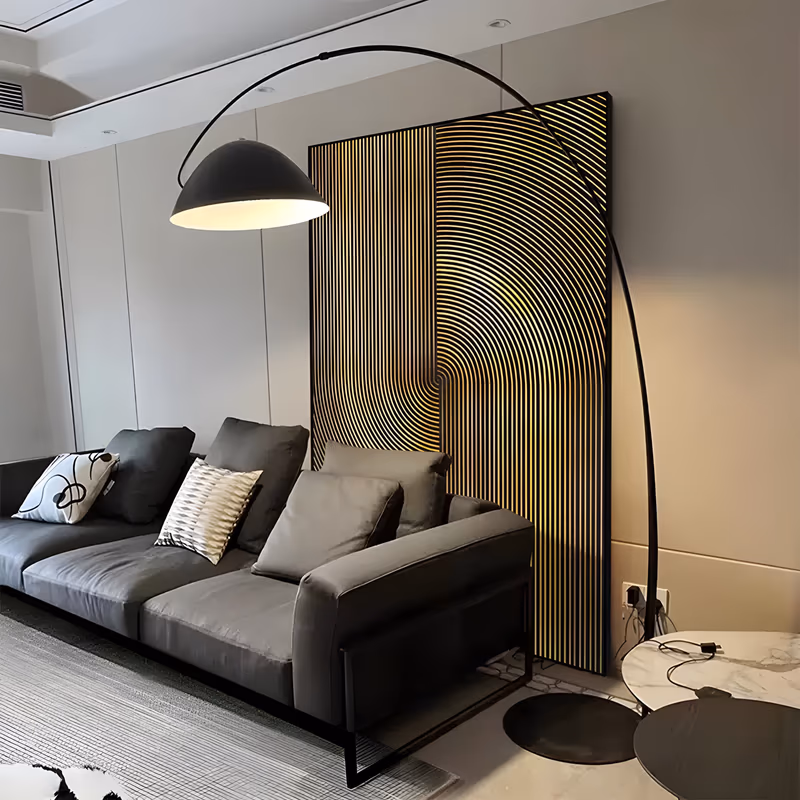 a large vertical minimalist relief panel of closely spaced black slats, a wide arc of concentric lines curving up the right side and catching warm brass gold light along every ridge, in carved wood-look relief