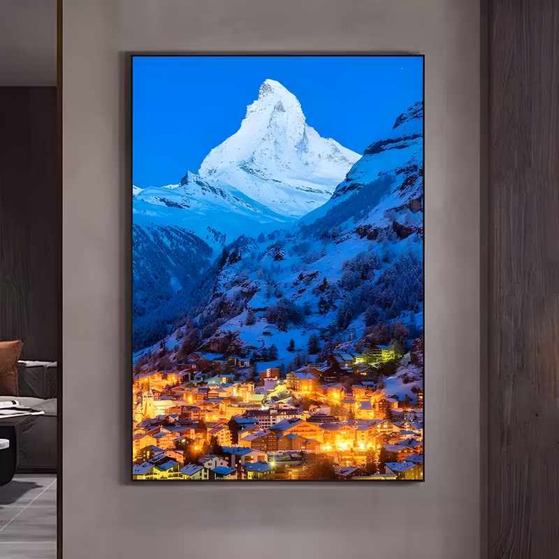 a large vertical landscape painting of the snow-covered matterhorn rising into a deep blue dusk sky, with forested slopes below and an alpine village glowing amber at the base of the frame, in crisp acrylic