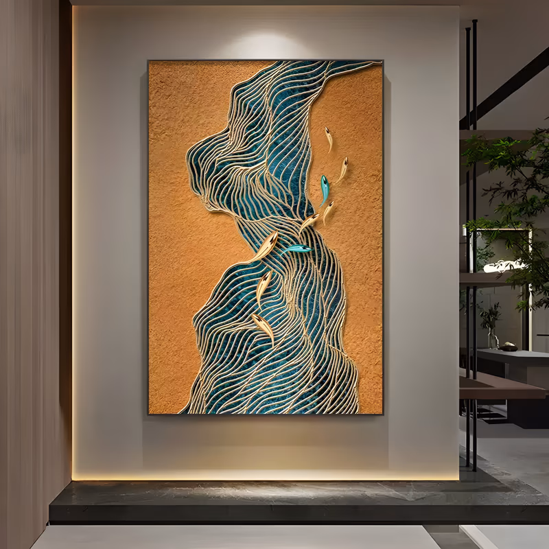 a large vertical 3D wall art piece of a winding teal river of raised gold lines from top to bottom over an orange plaster ground, with small gold and blue fish swimming along its upper edge, in sculpted relief