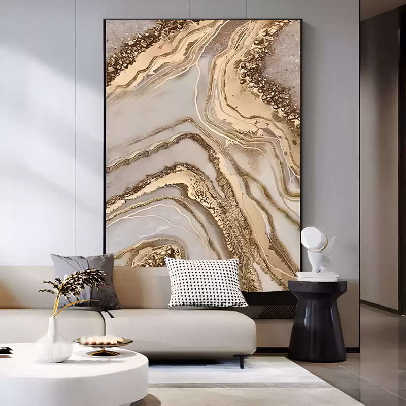 a large vertical abstract painting of marbled cream and pale beige stone, with thick gold veins and glittering mineral crusts winding from the top right down to the lower left, in raised textured acrylic