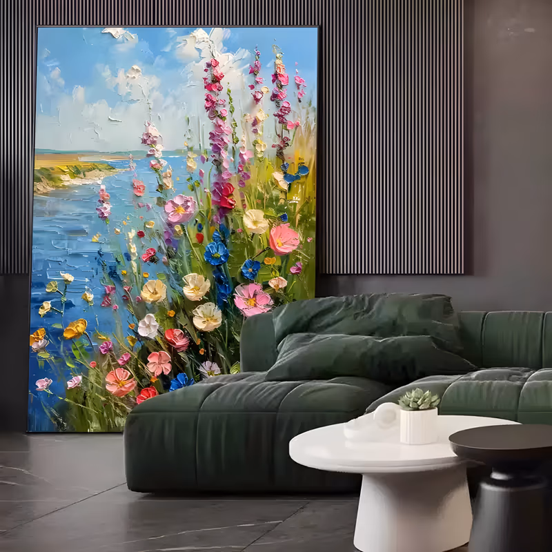a large vertical impressionist painting of tall pink and magenta foxgloves, white and yellow wildflowers massed in the lower right above a blue coastal bay and sandy cliffs, in heavy palette-knife impasto