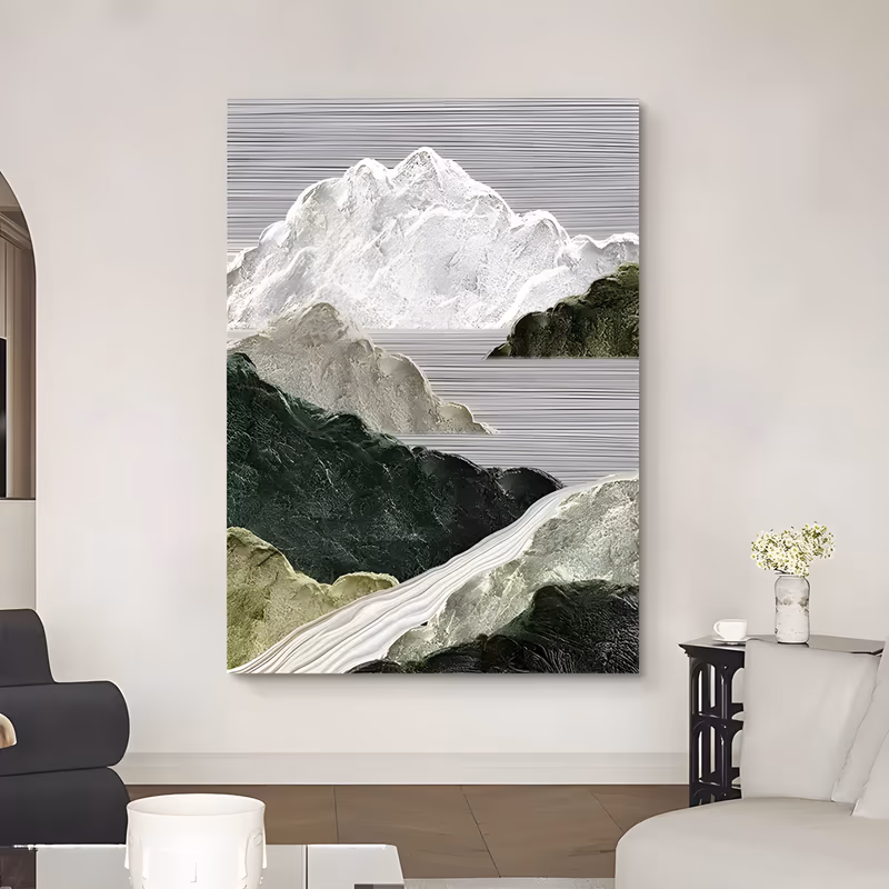 a tall vertical relief painting of a white snow-capped peak rising over layered dark green and sage hills, a pale river winding through the lower valley, all sculpted in raised plaster under a combed gray sky