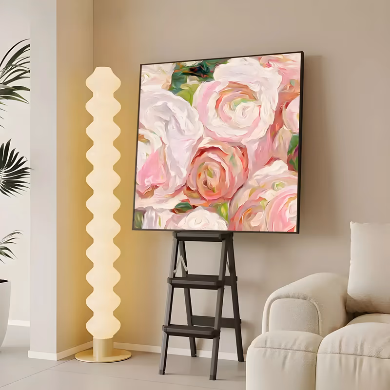a large square impressionist painting of soft pink and cream roses seen close up, their petals curling in wide swirling strokes with small green leaves showing between them, in thick glossy oil paint