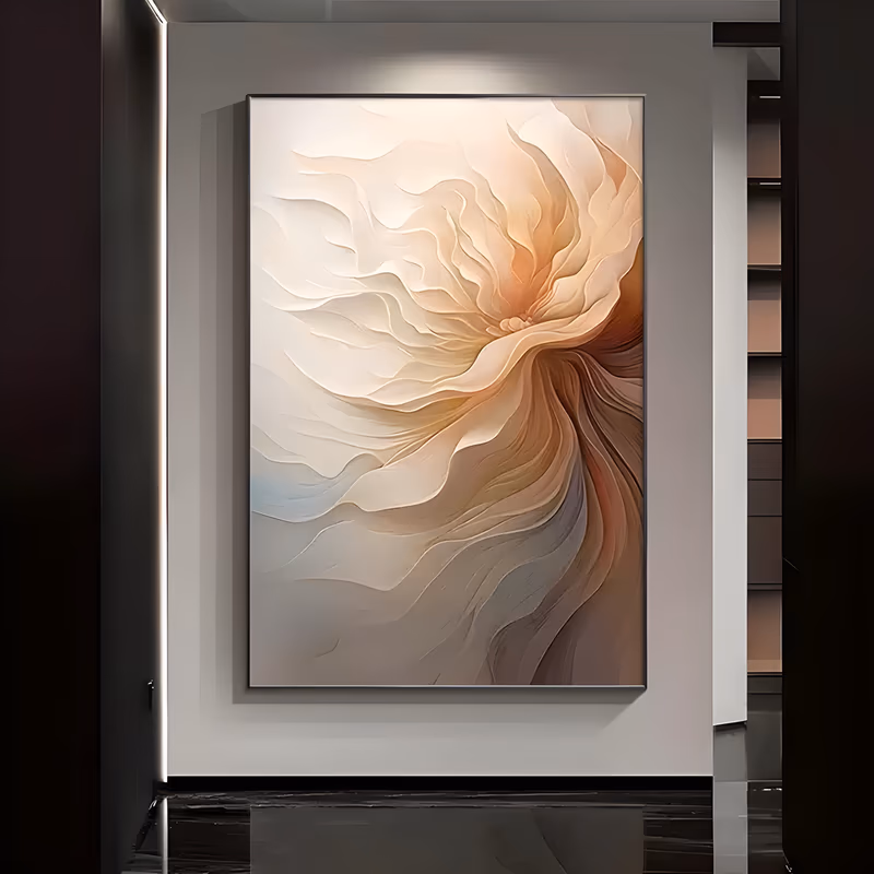 a large vertical sculpted relief canvas of overlapping cream and peach petals swirling out from a center near the top right, the folds deepening into gray-blue and soft brown along the lower edge