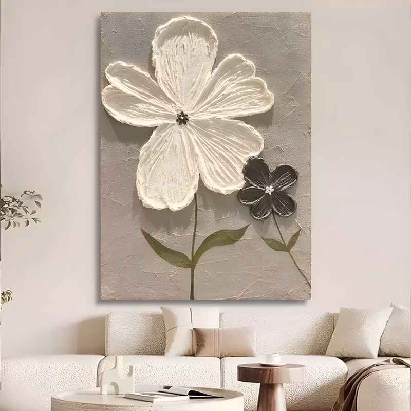 a large vertical plaster relief painting of one big white five-petal flower at the top with a small charcoal bloom beside it, both on slim olive stems, built up on a hand-troweled warm gray ground