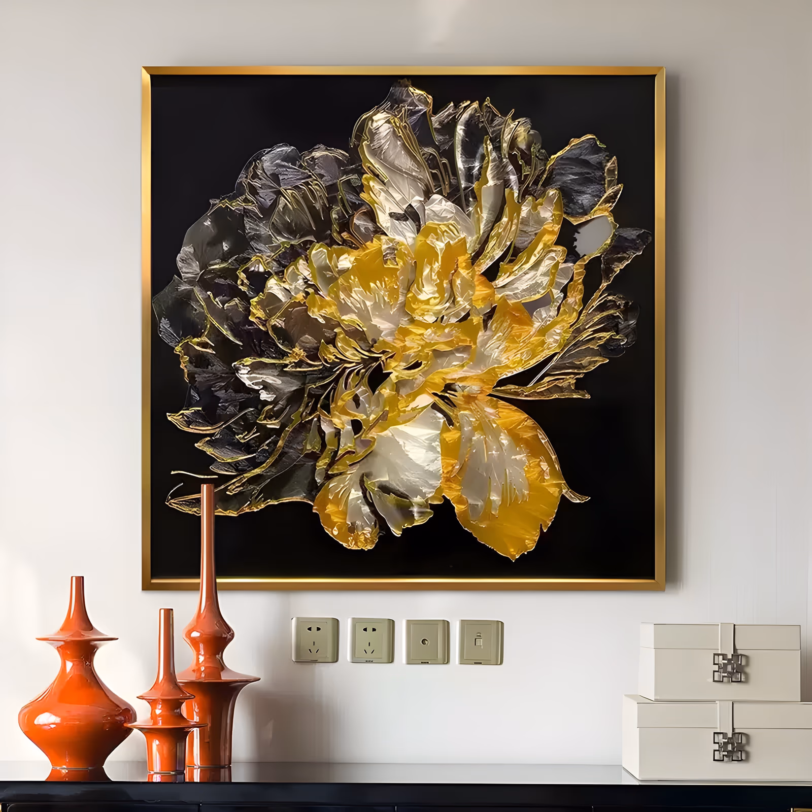 a large square textured floral wall art of a single open peony filling the frame, its ruffled petals sculpted in glossy gold, pewter and white against a matte black ground, in heavy relief paint