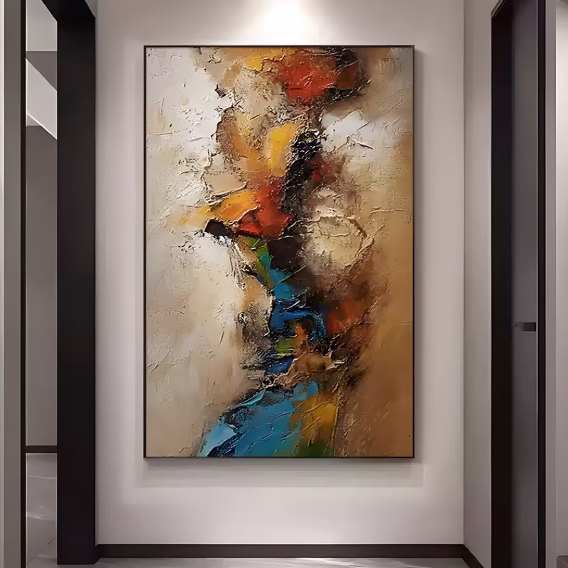 a large vertical textured abstract painting with a ragged column of red, gold, teal and green running down the center of a cream and warm brown plaster-like field, in heavy palette-knife impasto