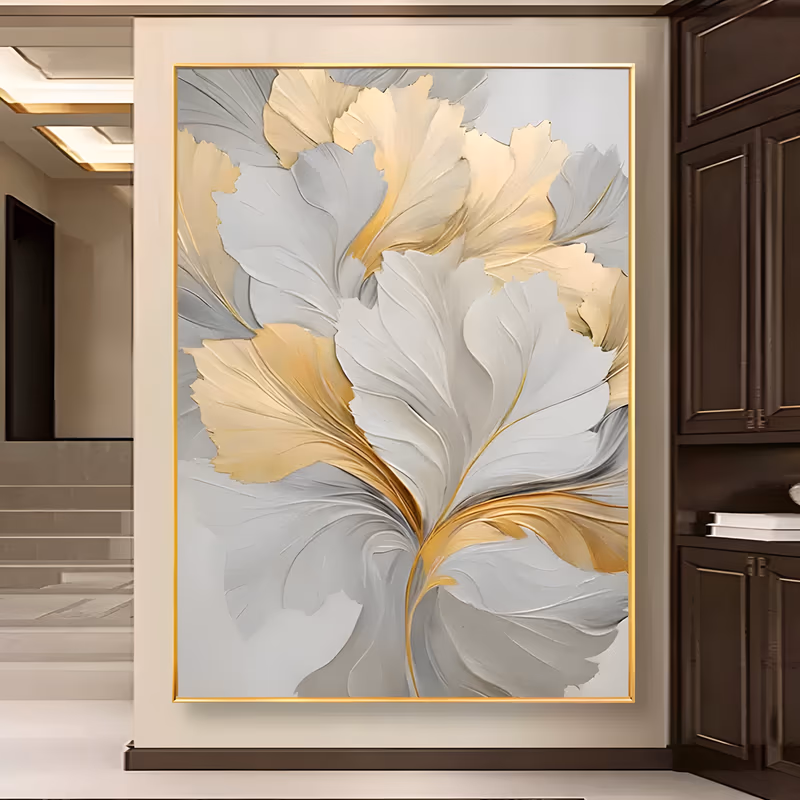a large vertical relief painting of overlapping ginkgo-shaped leaf fans in white, pearl gray and warm gold, fanning out from a slim gold stem at the base, built in sculpted plaster relief