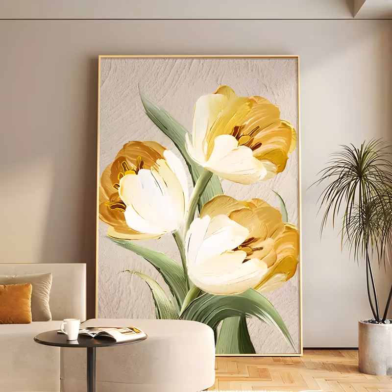 a large vertical textured painting of three tulips, gold and ochre outer petals cupping cream-white inner ones, green leaves rising from the lower edge on a rough plaster-white ground, in thick paint