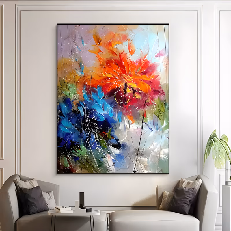 a large vertical abstract floral painting of a blazing red-orange bloom near the top, deep blue petals gathered at the lower left, and white splatter over a soft gray and cream ground, in fluid brushed acrylic