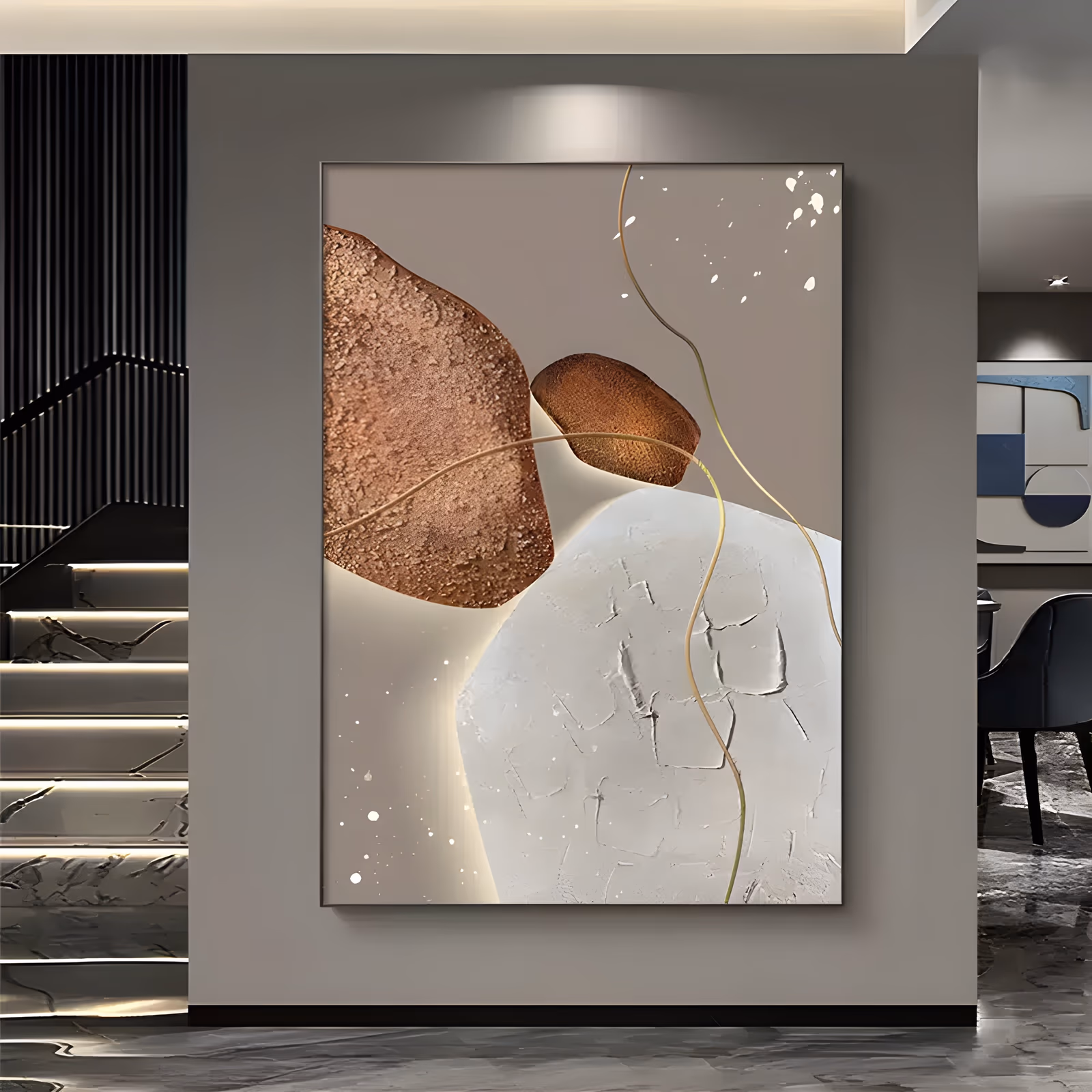 a large vertical textured painting of two copper-brown stones and one white plaster stone on a greige ground, threaded by thin wavy gold lines with white speckles scattered around them, in hand-troweled relief