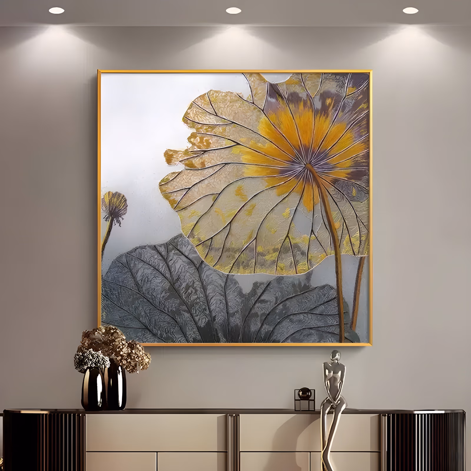 a large square textured botanical painting of a golden lotus leaf with raised radiating veins and a yellow center, a gray lotus pad below it and a dried seed head at the left, in thick relief paint