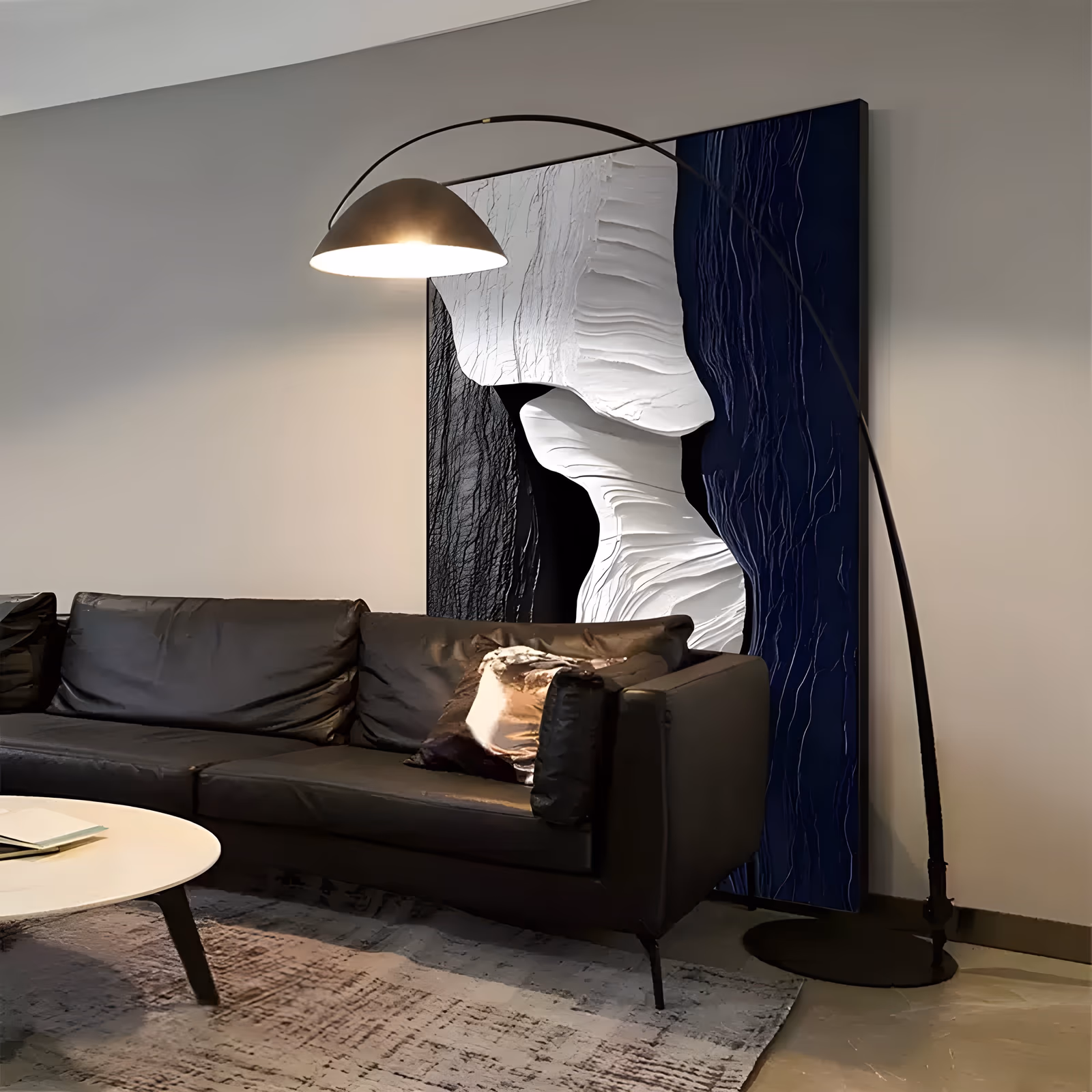 a large vertical abstract relief painting of a thick ivory ridged form flowing down the center between a matte black field on the left and a deep navy combed field on the right, in sculpted plaster