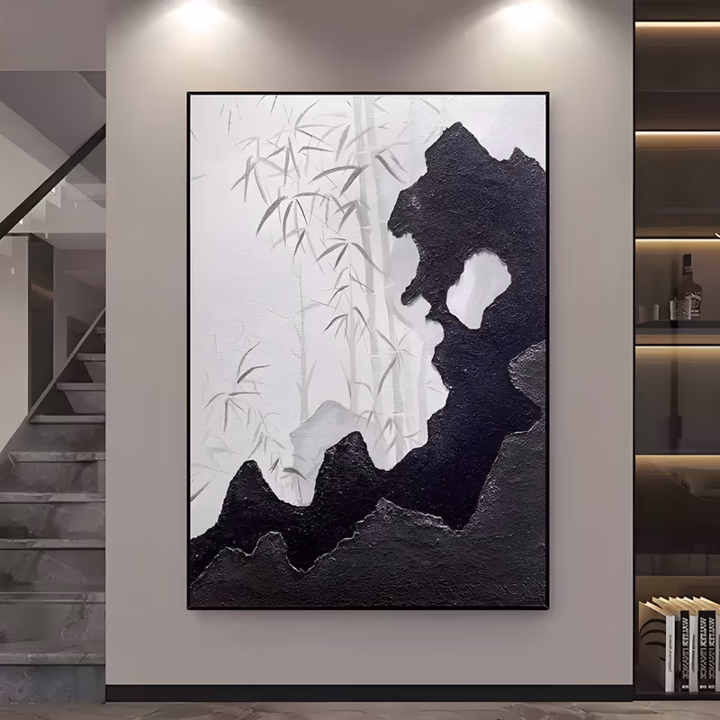 a large vertical textured painting of a bold black impasto rock form rising from the lower left to the upper right, with a white gap at its center and pale gray ink-wash bamboo behind it on a white ground