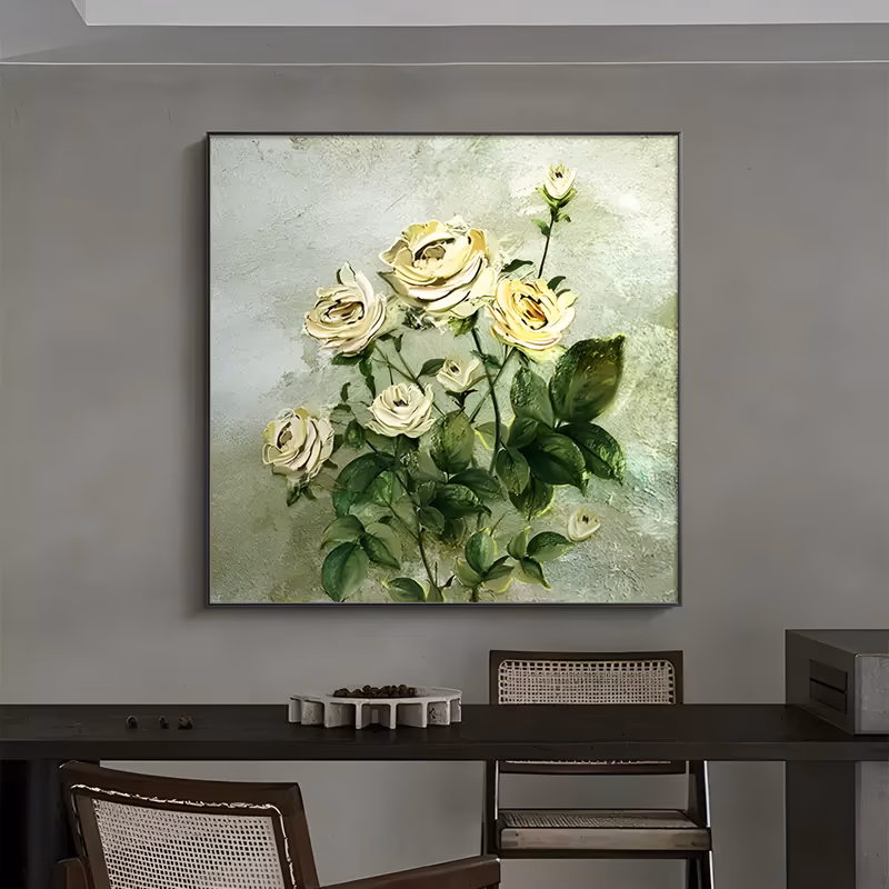 a large square textured painting of cream-yellow roses on green leafy stems, the blooms clustered through the upper half in thick knife-laid petals against a mottled pale sage ground