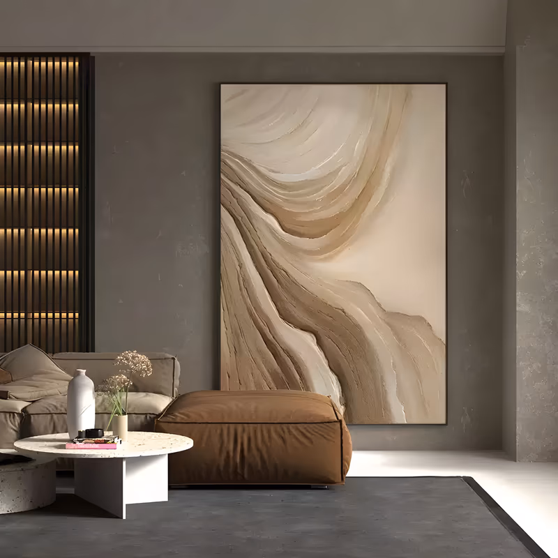 a large vertical relief painting of sculpted plaster waves, pale cream folds sweeping down from the top left and layered tan ridges building along the lower right, all in one sand palette, in thick troweled plaster