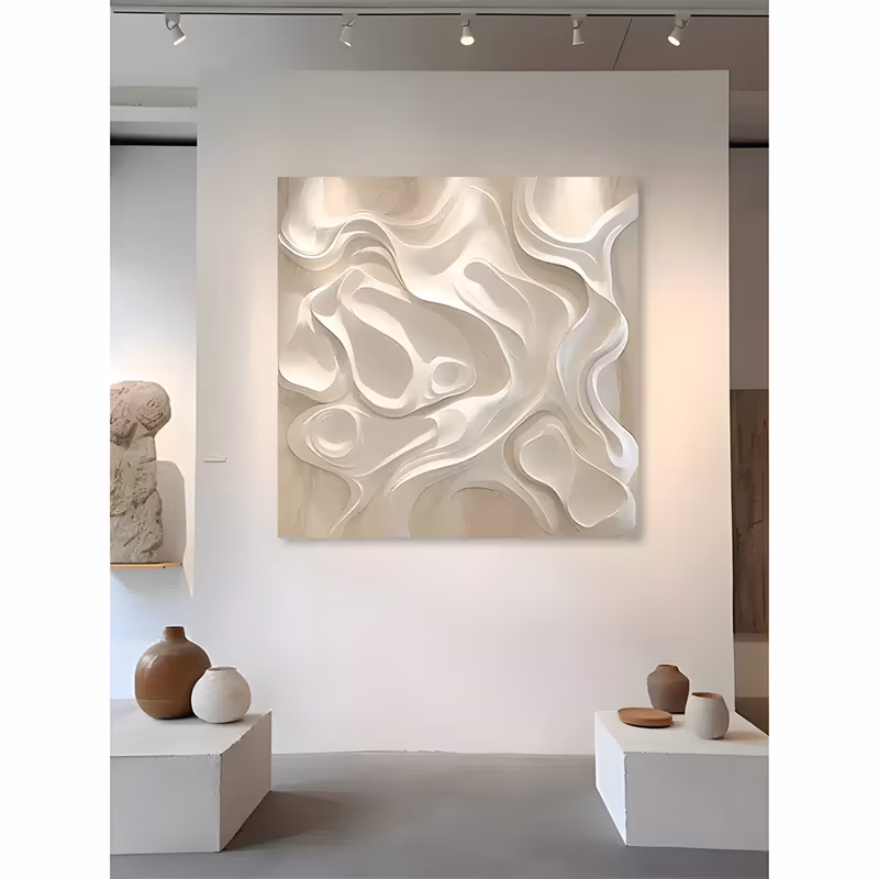 a large square relief panel of smooth flowing organic ribbons and rounded hollows in white and warm cream, curling over one another like poured cream, hand-sculpted in deep plaster relief
