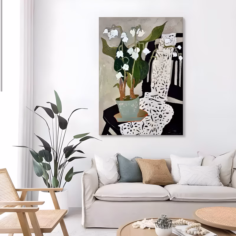 a large vertical naive still life painting of white lily of the valley in a pale celadon pot on a black chair, with a white crochet lace runner draped over the seat, in flat hand-painted oil
