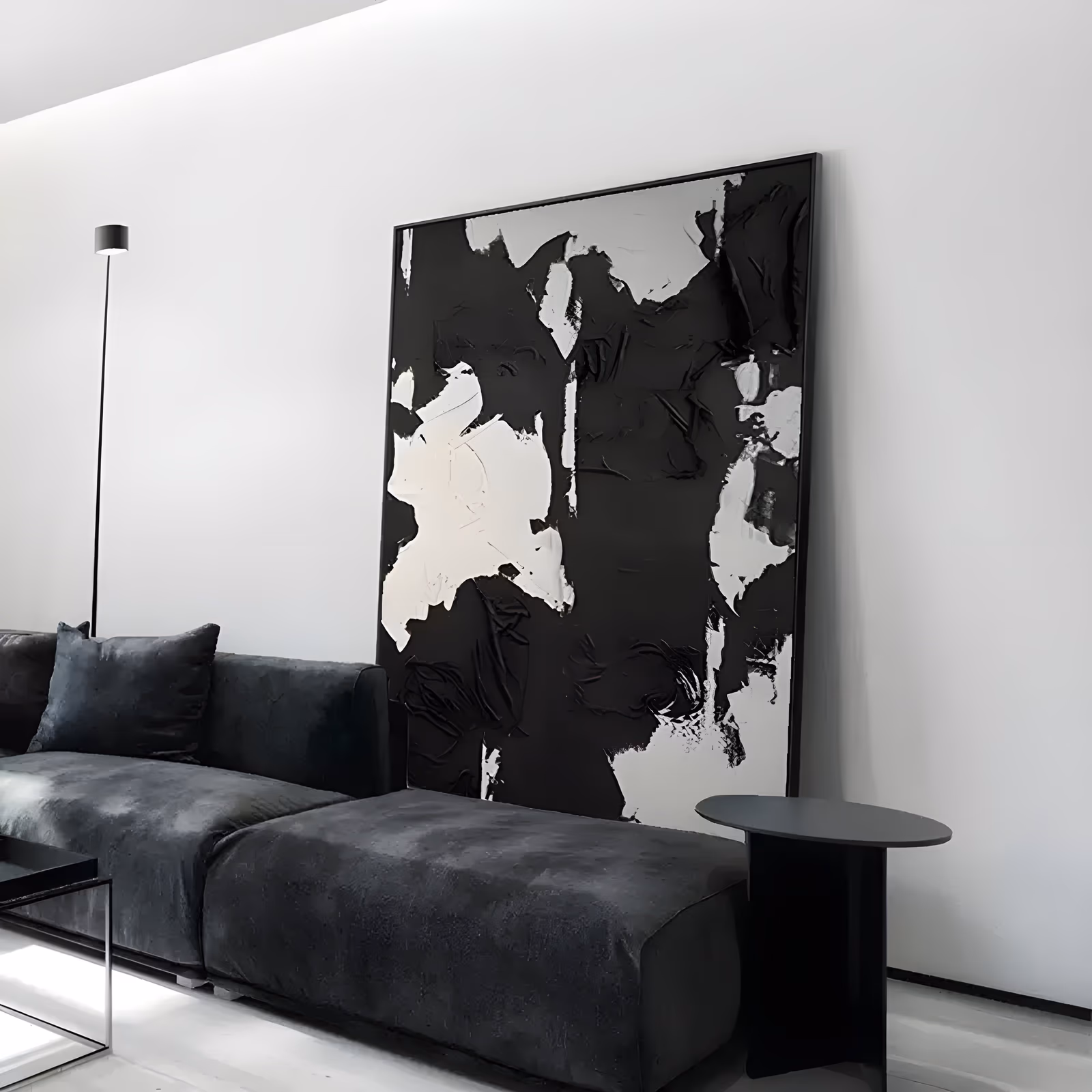 a large vertical abstract painting of heavy black and white paint applied in thick knife-laid patches, with white slabs breaking a dark field into irregular blocks, in deep sculpted impasto