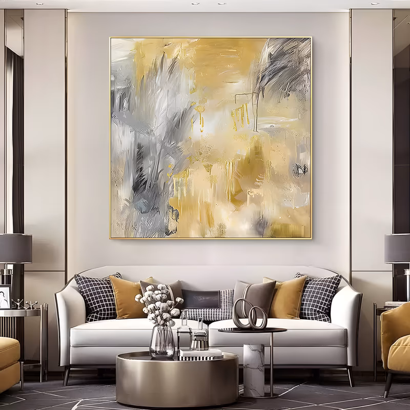 a large square abstract painting of broad butter gold and warm gray brushstrokes over a cream ground, with thin gold drips running down the center, in loose palette-knife and brush impasto
