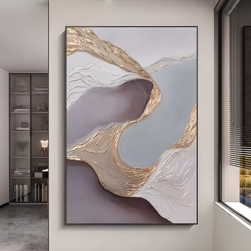 a large vertical textured abstract painting of a thick gold and cream ridge curling through the center of a soft gray-mauve and white field, built in raised plaster relief with sculpted ripples
