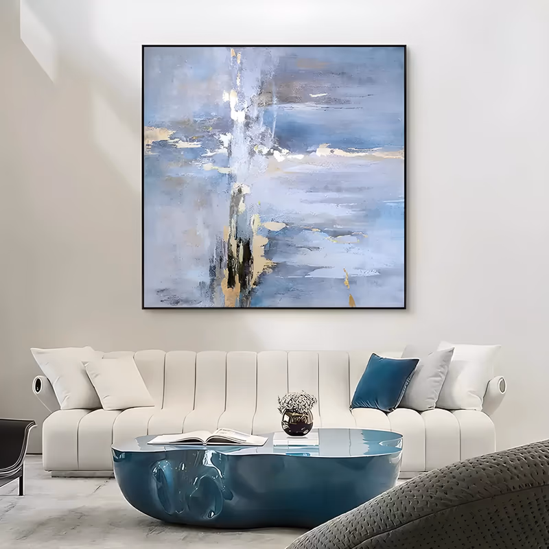 a large square abstract painting of pale blue-gray and lavender washes meeting at a soft horizon, with white streaks and gold leaf flecks scattered through the upper band, in thin brushed acrylic