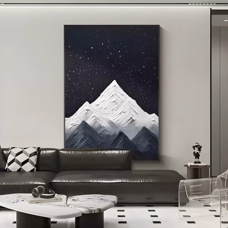 a tall vertical relief painting of white snow-covered peaks built in thick sculpted plaster, rising in the lower half of the frame against a near-black night sky flecked with small white stars