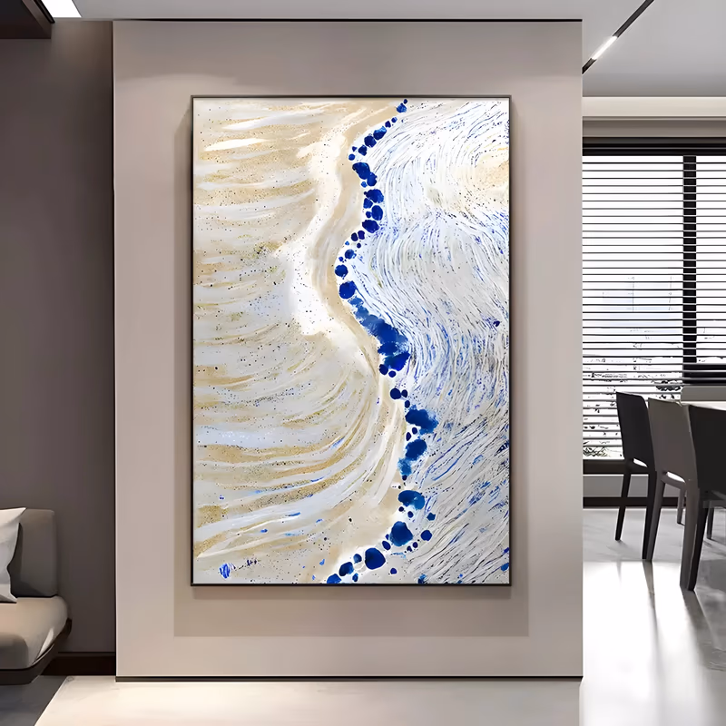 a large vertical textured painting of a shoreline seen from above, with ridged beige sand on the left meeting white swirling foam on the right and a line of cobalt blue blobs running between them, in thick paint