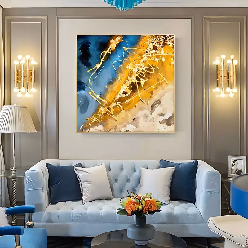 a large square abstract painting with a broad gold band set diagonally through deep teal and navy at the upper left, looping gold drip lines over it and cream marbling below, in gold leaf and thick paint
