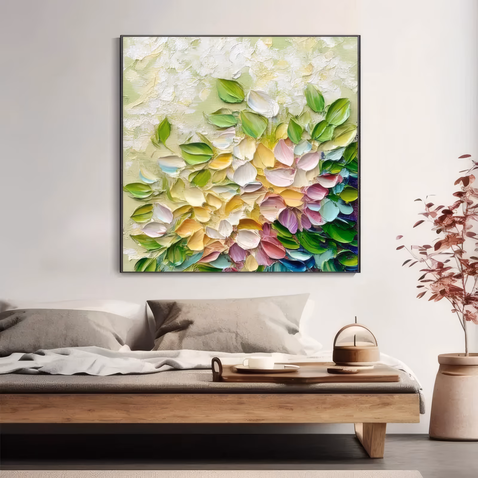 a square abstract floral painting of small petals scattered from the top left and massing at the lower right in green, pink, yellow, white and teal on a pale green ground, in thick palette-knife acrylic