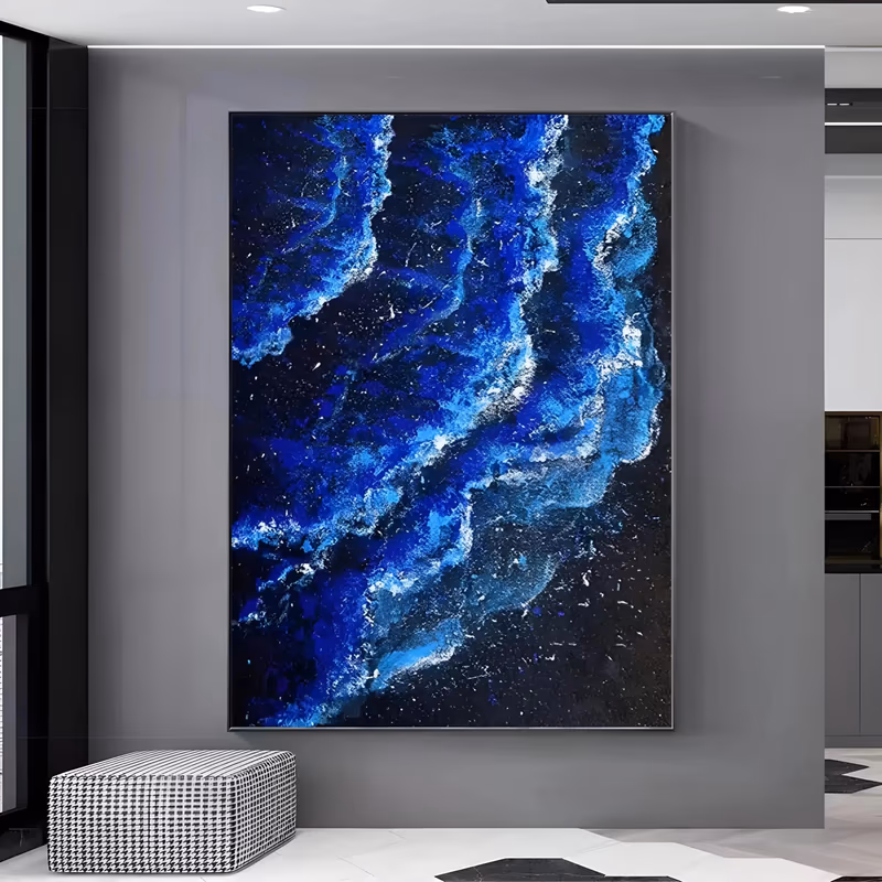 a large vertical textured painting of cobalt and electric blue wave crests rolling down a near-black ground, scattered with white foam speckles, built in heavy sculpted relief