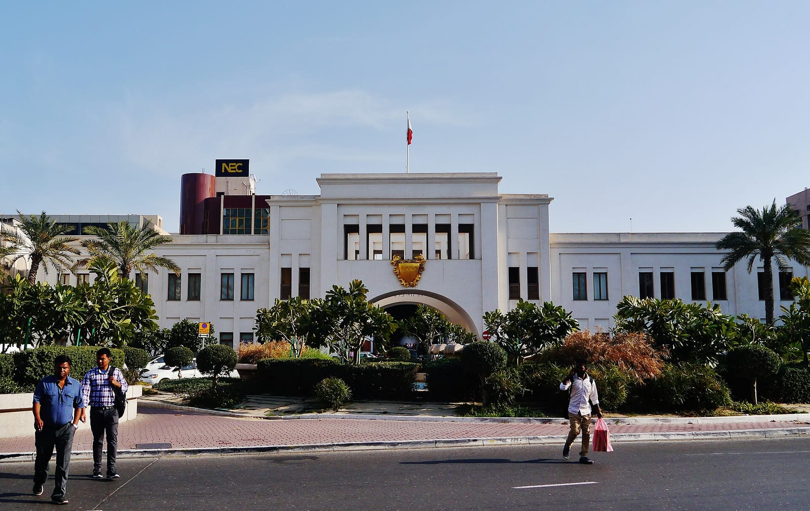 Bab Al Bahrain, the arched 1940s gateway to the Manama souq, with its clock and cream stone façade.