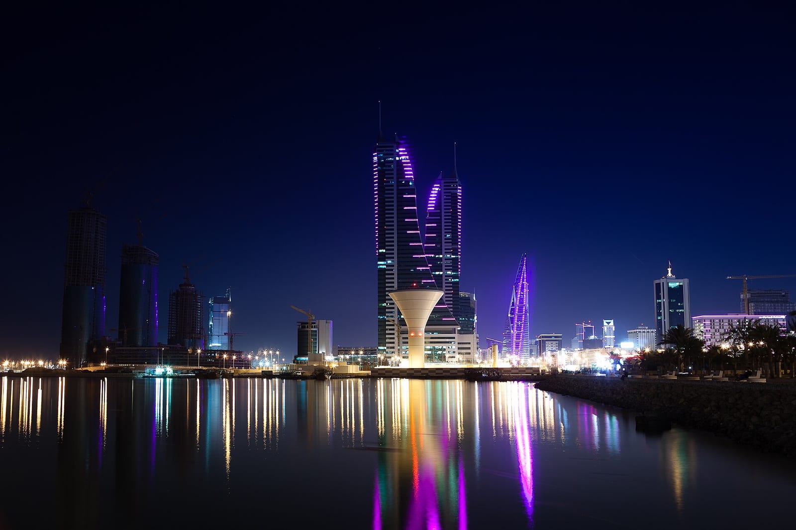 The twin towers of Bahrain Financial Harbour lit at night in a long-exposure view from the Manama waterfront, October 2013.