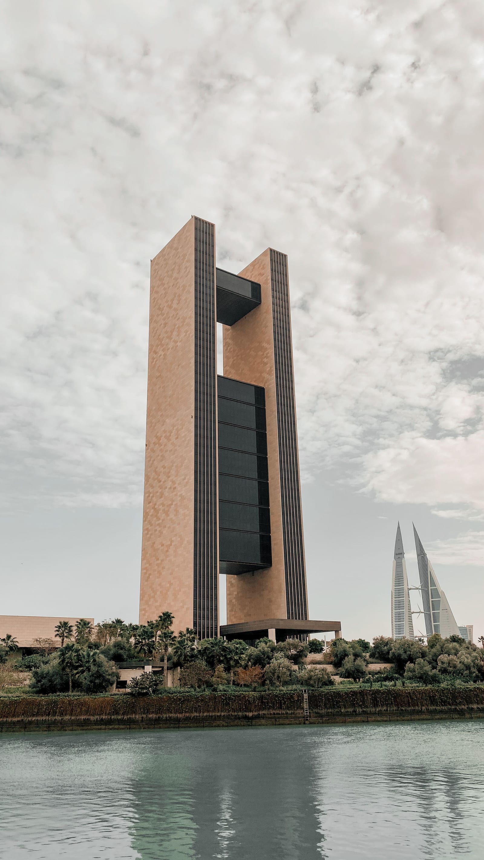 The Four Seasons Hotel Bahrain Bay tower rising from its own island in the sea off Manama, March 2022.