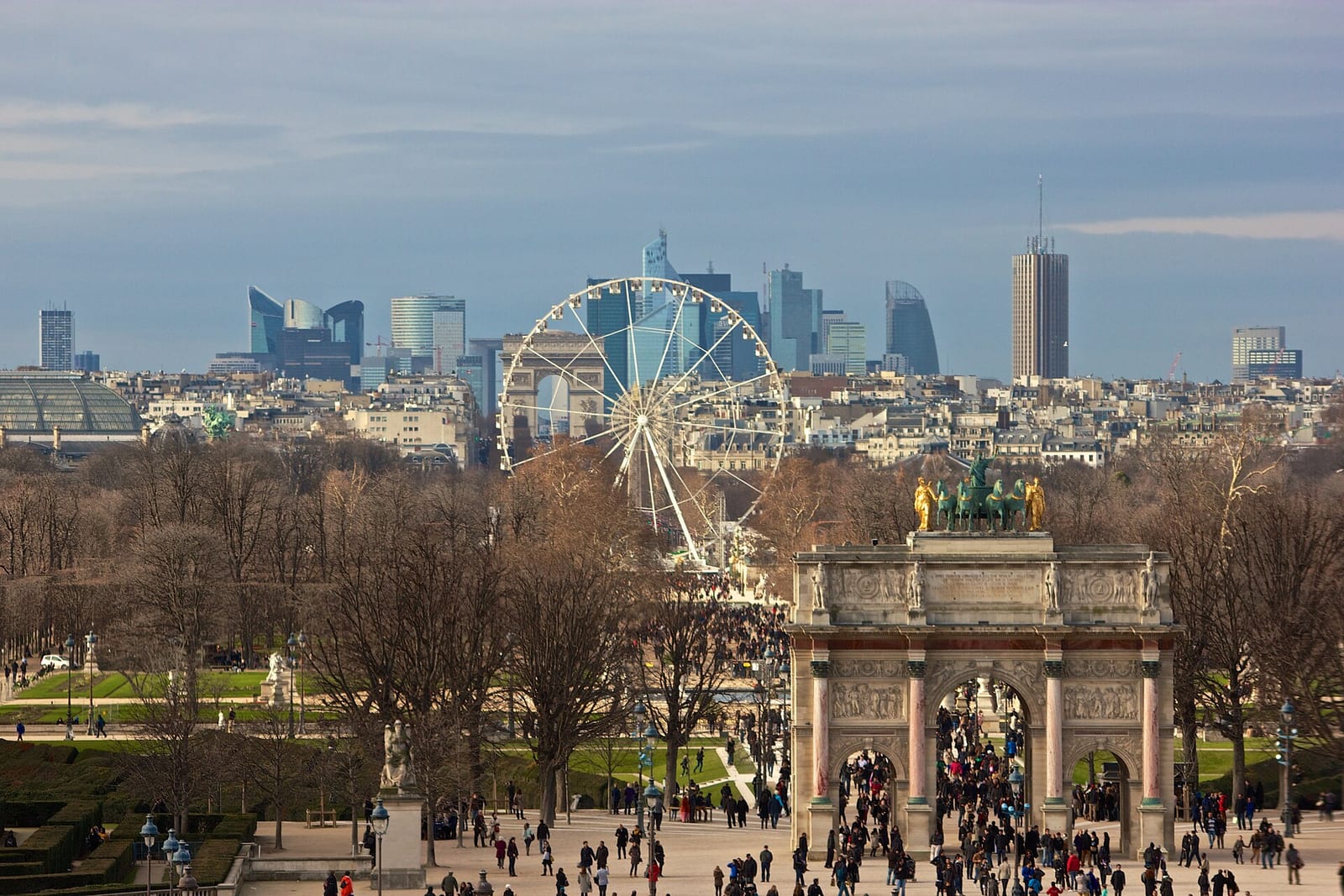 View from the Louvre along the Tuileries axis to the Arc de Triomphe du Carrousel and the La Défense towers in the distance.
